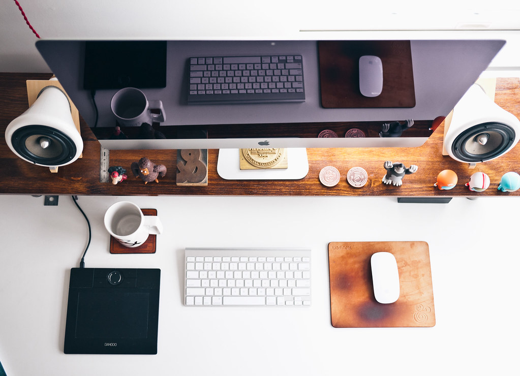 A computer screen, mouse and keyboard.