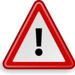 Warning sign, black exclaimation mark on a white background inside a red borner